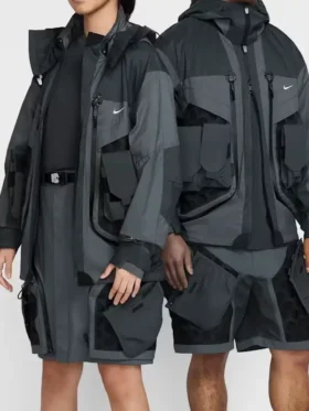 Nike ISPA Butterfly Jacket Anthracite Dark Grey Black colorway on male and female models showing full modular grid-shell pocket system front view