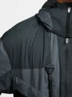 Water beading on Nike ISPA Butterfly Jacket Anthracite shoulder panel showing DWR water-repellent recycled nylon surface with ISPA Protect badge