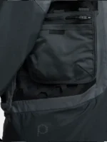 Open modular cargo pocket on Nike ISPA Butterfly Jacket Anthracite showing interior zip compartment ISPA branding and hexagonal rubber grid panel