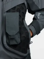 Single dark grey modular pocket mounted on black hexagonal rubber grid panel of Nike ISPA Butterfly Jacket Anthracite with ISPA sleeve branding