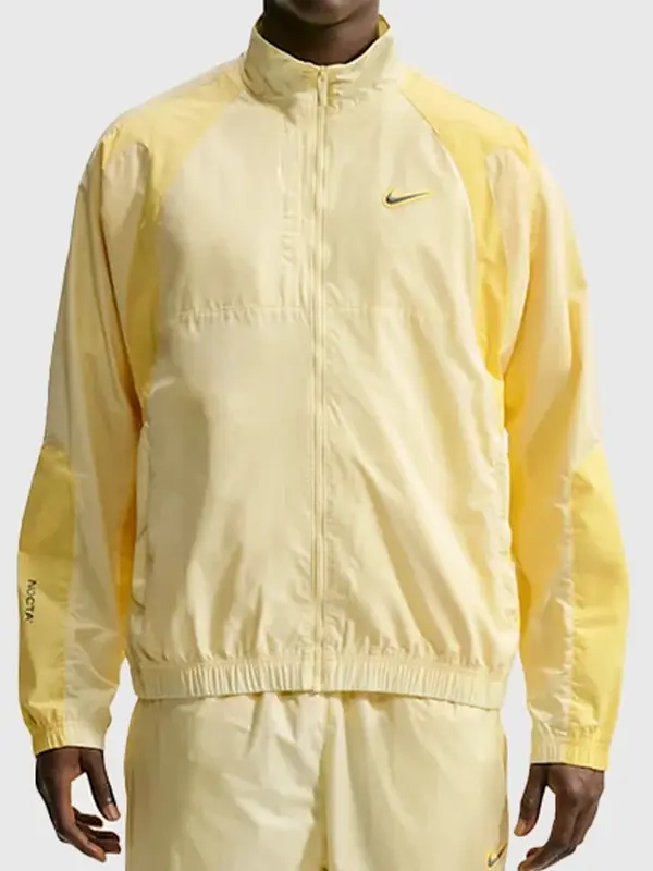 NOCTA Northstar Yellow Track Jacket in polyester fabric with stand up collar, zipper closure, and elastic cuffs