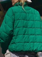 Clean rear view focusing on the uniform horizontal quilting panels of the Pippa Packable Dark Green Puffer Jacket.