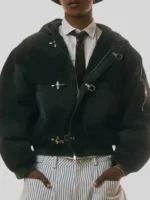 Dark green Shinzo Shige canvas clasp bomber jacket styled with striped trousers and tie in editorial shoot