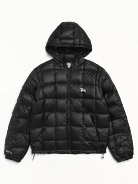 Front view of black Stussy Hooded Puffer Jacket with quilted nylon design and hooded collar