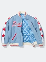 Supreme x Mitchell and Ness Atlanta Braves Varsity Jacket open view showing blue quilted satin interior lining red star sleeve applique and cream ribbed collar