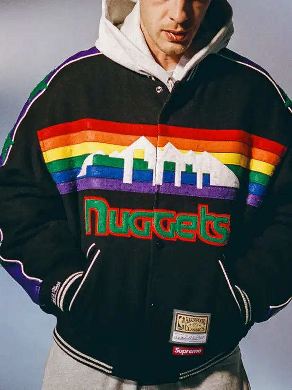 Supreme x Mitchell & Ness Denver Nuggets black wool varsity jacket front, rainbow skyline graphic and green Nuggets script lettering
