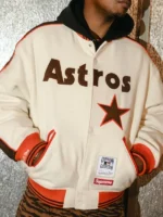 Supreme x Mitchell & Ness Houston Astros cream wool varsity jacket front, brown Astros lettering and orange star applique sleeves