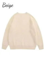 The Unavowed Sweater back view in beige knitted fabric with round neck collar, pullover style closure, full length sleeves and rib knitted cuffs and hem