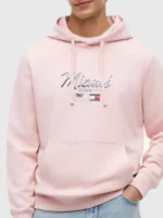 The tailored unisex fit presentation of the pink Tommy Hilfiger Cadillac F1 Miami Hoodie.