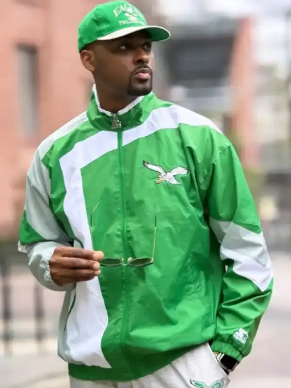 A premium standalone profile presentation of the green and white HOMAGE x Starter Eagles Jacket shell.