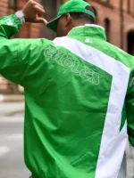 Full presentation layout view highlighting the vibrant team colors of the HOMAGE x Starter Eagles Jacket.