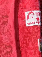 2026 Coachella Teddy Swims Red Coat Close-Up View