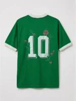 Studio flat-lay of the reverse view of the green Brazil 10 Goal Tee highlighting the large off-white drop-shadow number 10 and surrounding floral embroidery.