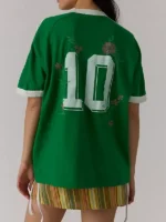 Rear view of the green Brazil 10 Goal Tee showcasing a large block number 10 graphic intertwined with custom pink floral embroidery.
