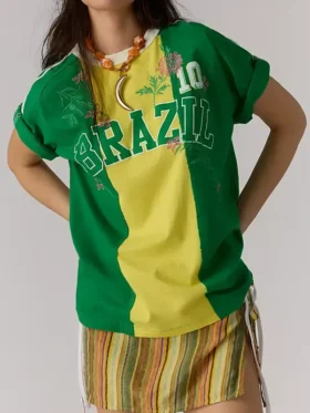 Front view of a vintage green and yellow soccer-style polo t-shirt with "BRAZIL" text, a white contrast collar, and delicate floral embroidery accents.