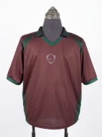 Full front view of the maroon and green CJ x Nike Portugal Total 90 Retro Jersey on a mannequin torso.