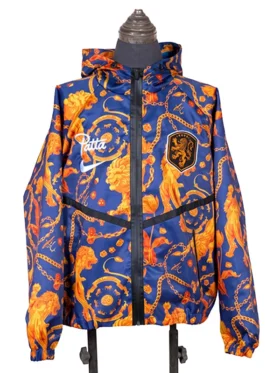 Full front view of the hooded blue FIFA World Cup 2026 Netherlands Anthem Jacket on a mannequin, highlighting the Patta, Nike, and KNVB branding over the orange Dutch icon print.