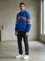Blue and white Kith Knicks 2026 Champions Bomber Jacket celebrating the New York Knicks historic 2026 NBA Finals title