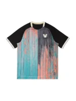 Front view of the NOCTA Pre-Match Jersey II featuring a turquoise and coral abstract woodgrain sublimated print with black raglan sleeves.