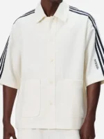 Full front presentation view highlighting the clean button front of the Adidas Kith Lionel Messi Football Shirt.
