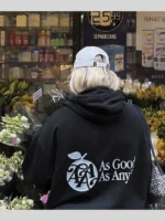 As Good As Any Soho NYC black hoodie back lifestyle view with white brand graphic outdoors