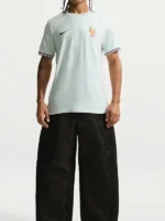 Model wearing the France National Team 2026 Away Soccer Jersey paired with black shorts in a full-body view.