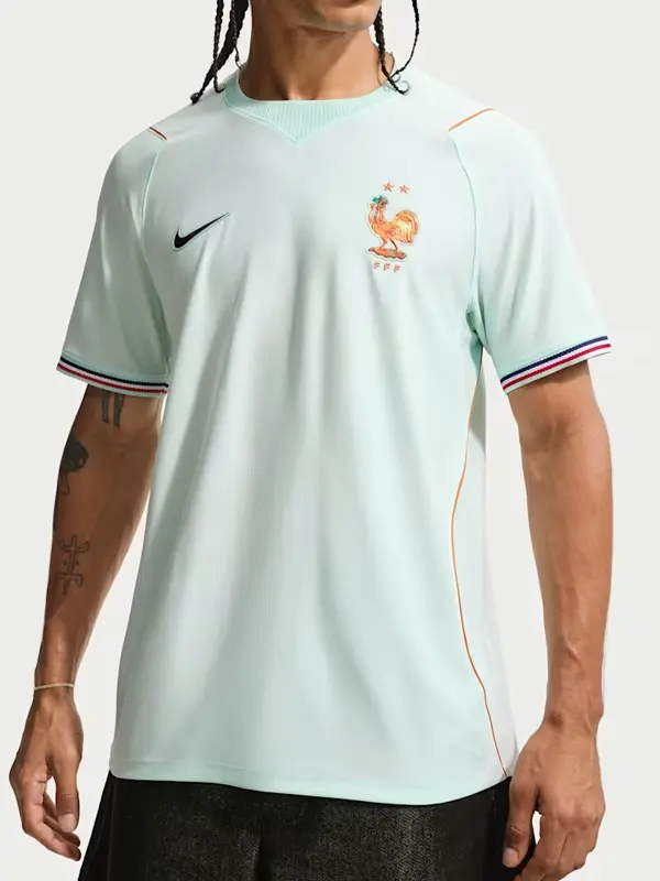 Men's Nike Dri-FIT France National Team 2026 Stadium Away Soccer Jersey in light green shown from the front on a model.