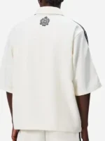 A premium standalone profile presentation of the crisp white Adidas Kith Lionel Messi Football Shirt.