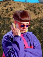 Oliver Tree wearing the Alien Boy pink and purple jacket in an outdoor fashion photoshoot