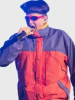 Oliver Tree performing in the All That x Alien Boy pink and purple jacket with microphone