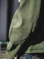 Swedish military motorcycle jacket sleeve military green cotton curved seam construction and open hem button cuff detail