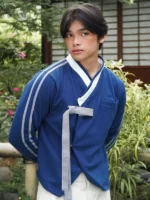 Close view of BABYMONSTER x YBSY Hwarang Hanbok Jacket in blue showcasing fabric texture and premium Hanbok inspired details