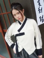 Close-up of BABYMONSTER x YBSY Hwarang Hanbok Jacket in white highlighting fabric texture and Hanbok inspired details