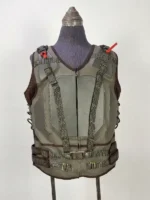 Front view of the Dark Knight Rises Bane tactical vest on a mannequin, featuring dark green leather, shoulder webbing with grommets, and brass metal buckles.