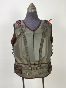 Front view of the Dark Knight Rises Bane tactical vest on a mannequin, featuring dark green leather, shoulder webbing with grommets, and brass metal buckles.