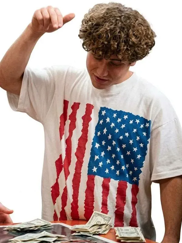 Gabriel LaBelle Snack Shack USA Flag T-Shirt Front Look Front look of Gabriel LaBelle Snack Shack USA Flag T-Shirt featuring USA flag artwork and a relaxed everyday silhouette