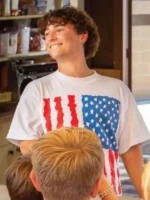 Front view of Gabriel LaBelle Snack Shack USA Flag T-Shirt featuring an American flag graphic, classic crew neck, and casual fit