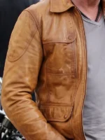 Close-up of Gerard Butler Brown Leather Jacket highlighting leather texture, stitching, zipper hardware, and refined craftsmanship