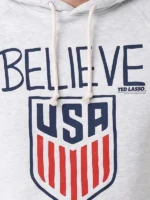 Homage Ted Lasso Believe x USA Crest Hoodie design view showing USA crest graphics and Believe artwork
