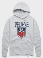 Front view of Homage Ted Lasso Believe x USA Crest Hoodie with USA crest graphics and relaxed fit