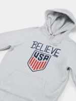 Homage Ted Lasso Believe x USA Crest Hoodie featuring USA crest graphics, casual hoodie style, and fanwear appeal