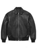 Front view of a black leather bomber-style jacket featuring an embossed Spider-Man web design and central spider logo, with a silver zipper and ribbed cuffs.