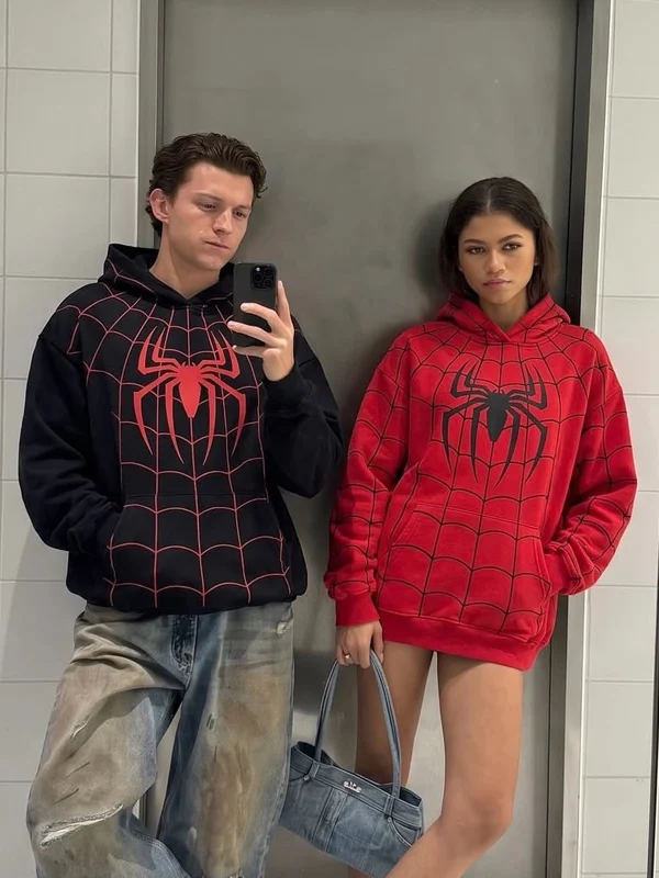 Spiderman Zendaya And Tom Holland Hoodie Couple View Couple view of Spiderman Zendaya And Tom Holland Hoodie featuring coordinated superhero-inspired casual outfits
