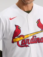 Close-up of the white Jordan Walker Cardinals jersey with red bird graphics, team lettering, V-neck, and button closure.