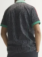 Mexico embroidered jersey back view showing black carbon geometric pattern, green sleeve cuffs and relaxed loose-fit shape
