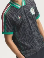 Mexico embroidered jersey angled view showing V-neck collar, sleeve stripes, green cuffs and detailed chest embroidery